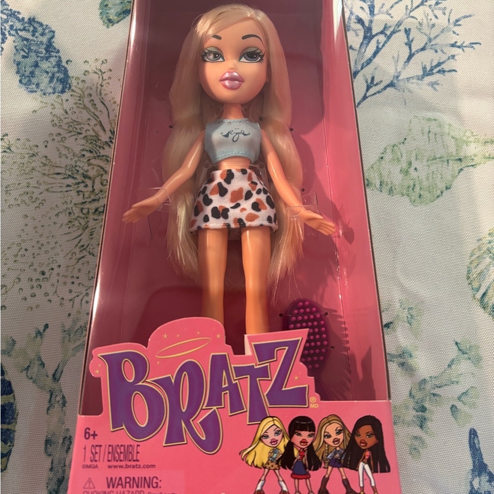 Doll with Blonde Hair and Leopard Skirt